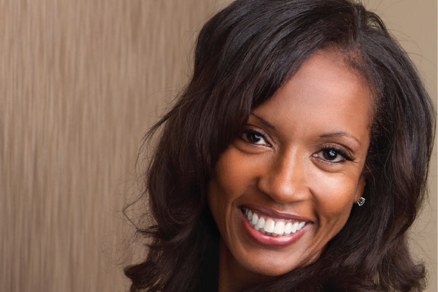 woman smiling to show off her professional teeth whitening results