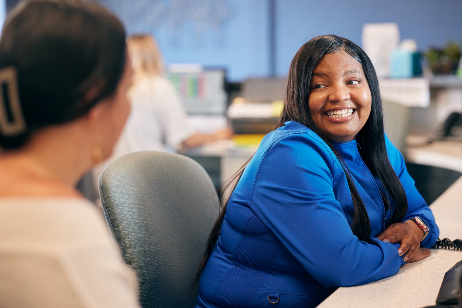 woman at carolinasdentist ready to help schedule a patient for convenient dentistry