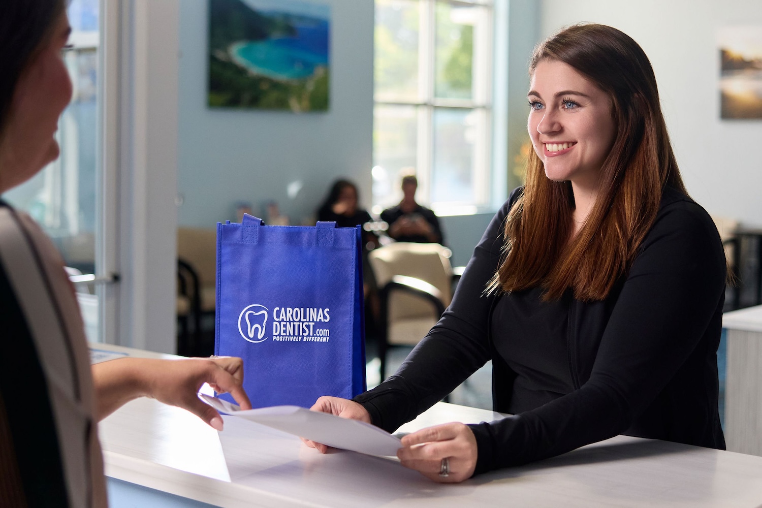 woman using her dental benefits at CarolinasDentist dental insurance dental membership