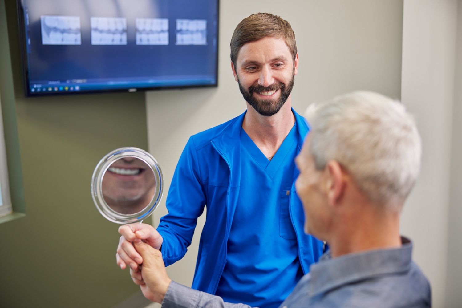 man smiling after restorative dentistry
