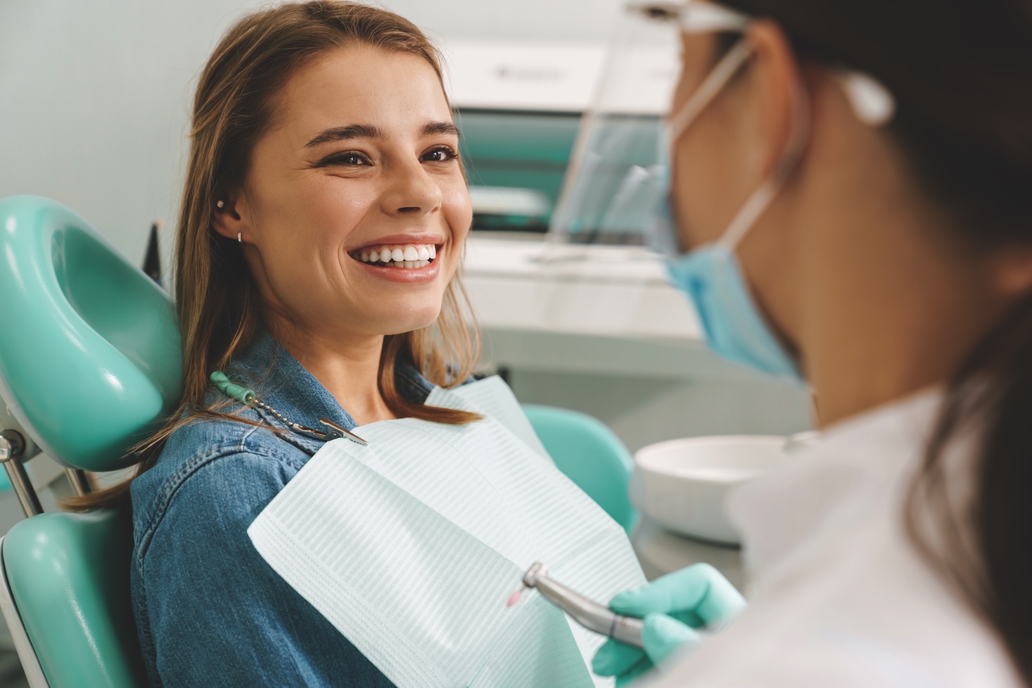 woman at dentist to fix dental problems before the new year