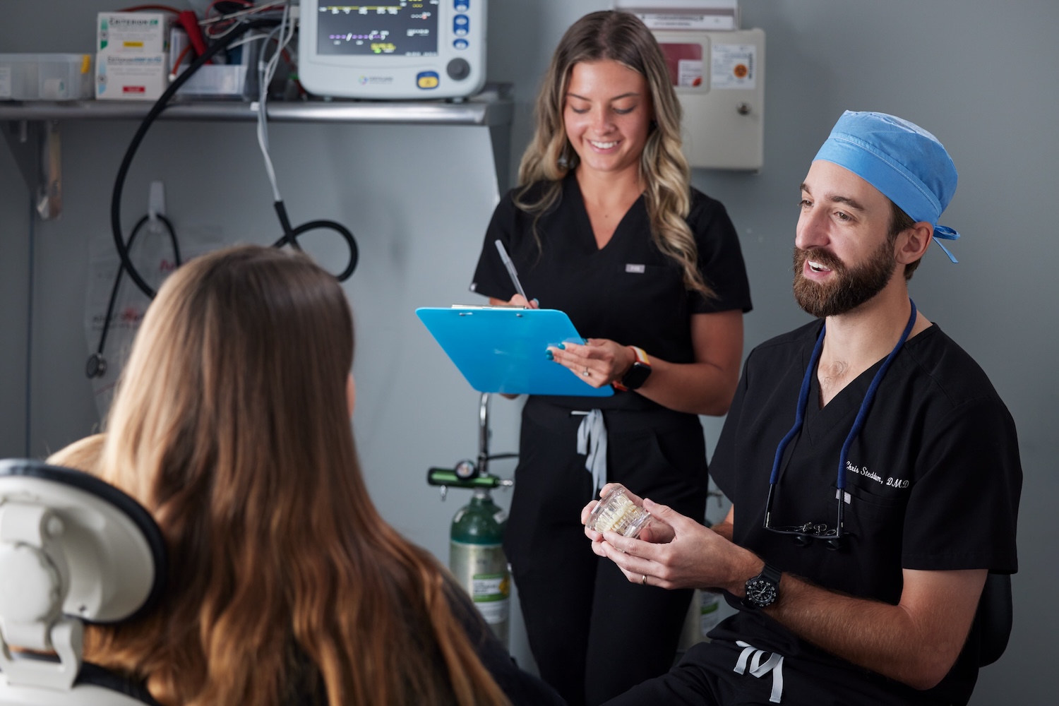 dentist explaining treatments like root canal therapy to a patient at CarolinasDentist in North Carolina