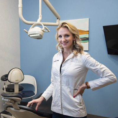 carolinasdentist-article-garner-2 Dr. Harn smiles in a white jacket in a private treatment room at CarolinasDentist in Garner, NC