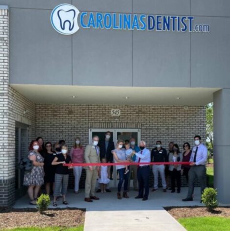 The CarolinasDentist team cutting the ribbon at the opening of the Garner location