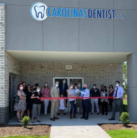 carolinasdentist-article-garner-3 The CarolinasDentist team cutting the ribbon at the opening of the Garner location